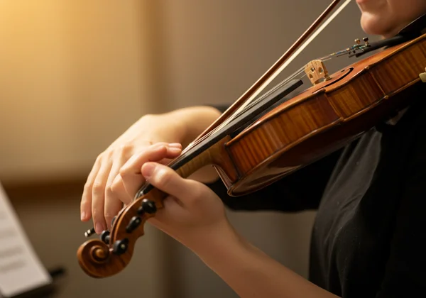 Violinist playing confidently after successful tuning session
